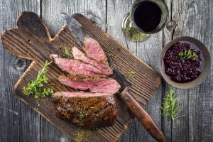 venison steak on a cutting board